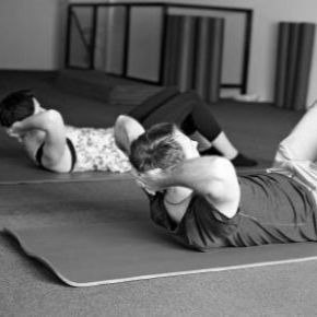 male and female doing Pilates sit up, could this help to reduce stress?