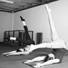 Male and female doing Pilates exercise, Control Balance